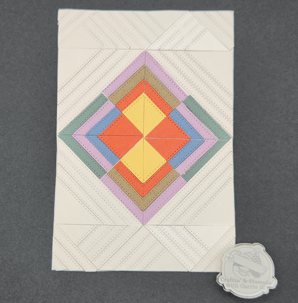 thumbnail for a geometric quilt card design layout tutorial wooing a multicolored diamond shape