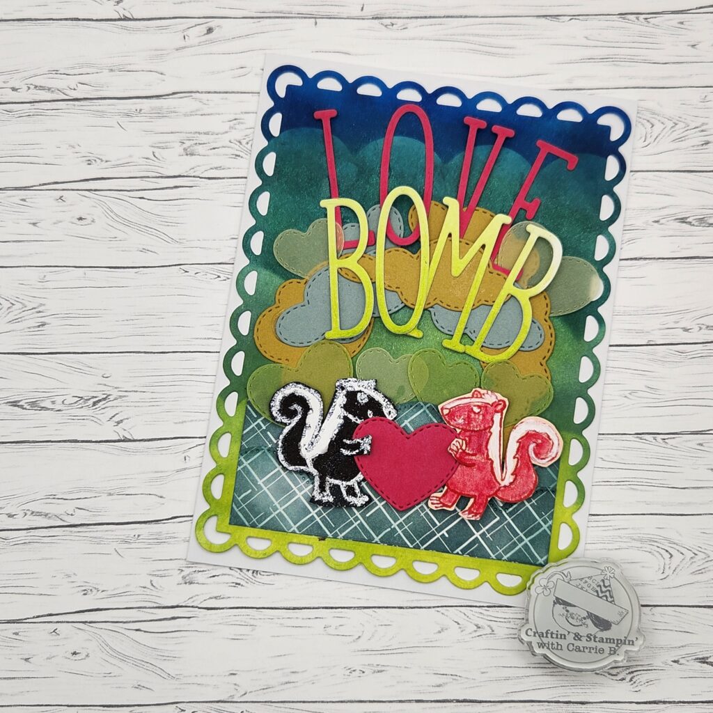 a card front featuring 2 skunks in love